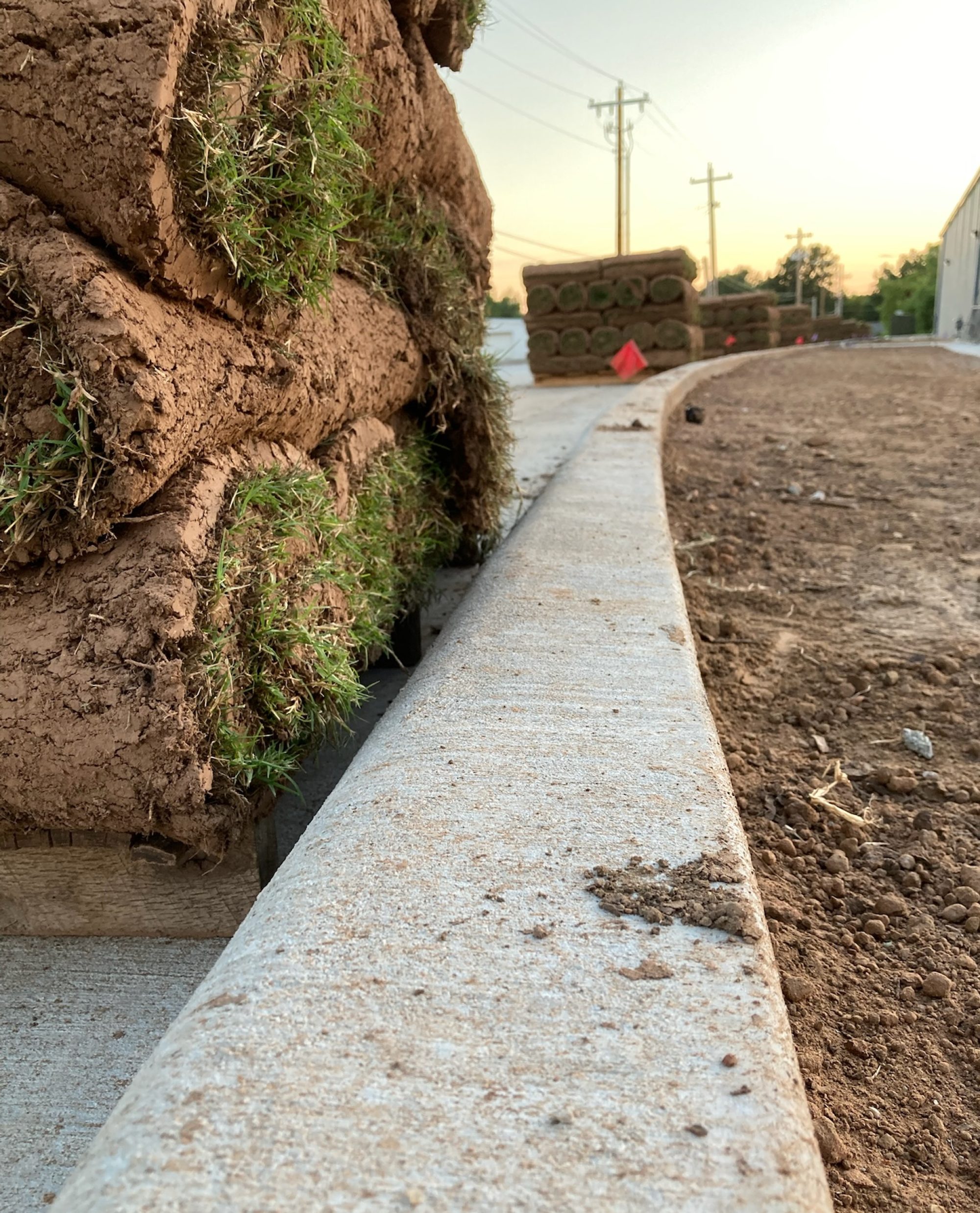Fresh Sod Rolls for Commercial Installation, showing sod installation for a Tulsa, Oklahoma lawn project from Quantum Sod.